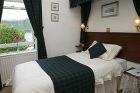 Tartan Bed Throw and Curtains<br />Ashburn House<br />Achintore Road<br />Fort William